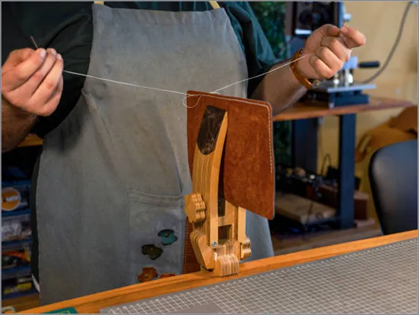 A man is working on a piece of wood.